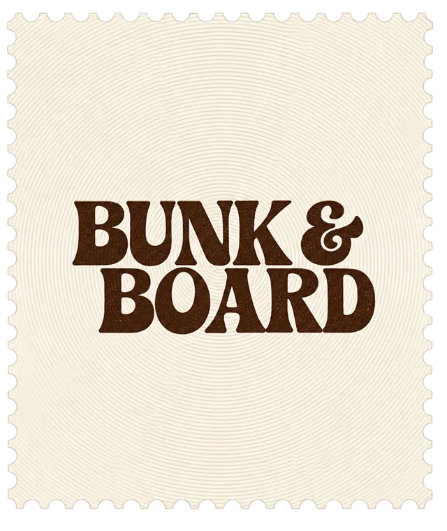 Bunk & Board wordmark in brown on a cream postage stamp